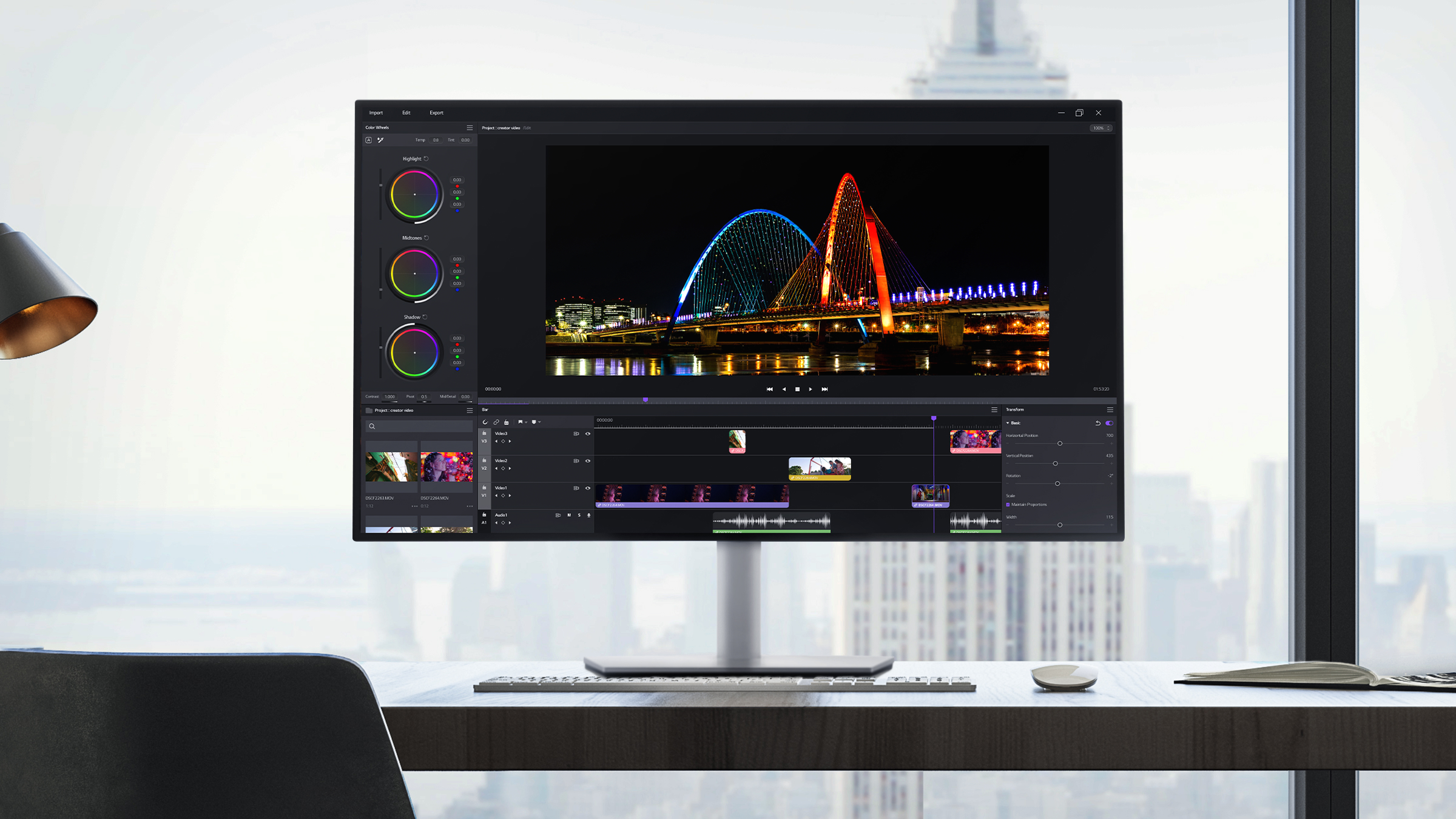 LG Display IPS Black 2.0 monitor placed on a desk near a window. The screen shows a design program editing a night scene photo, seamlessly blending with the cityscape background outside the window.